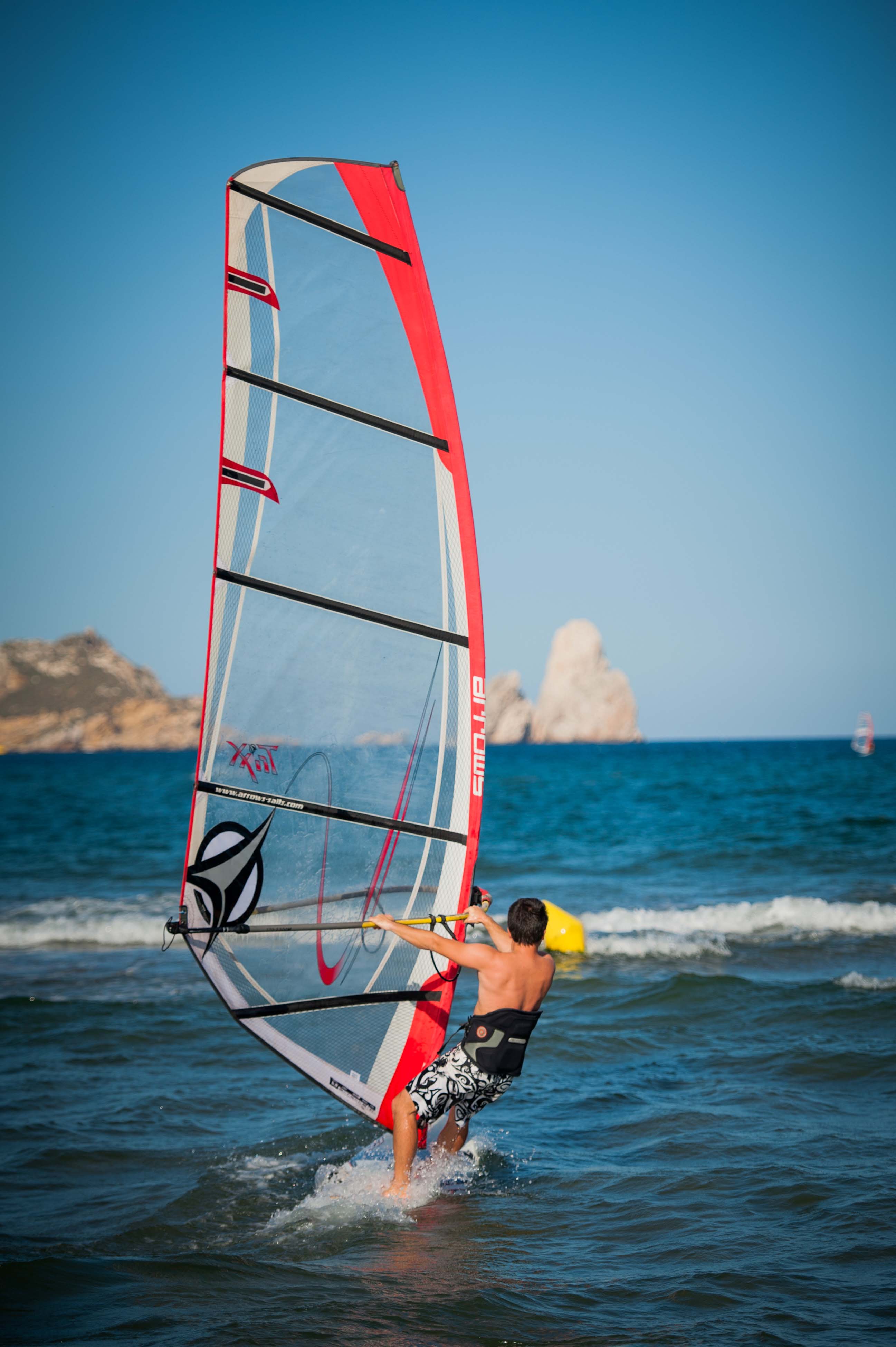l estartit spain august 8 2021 man rides windsurfing boat